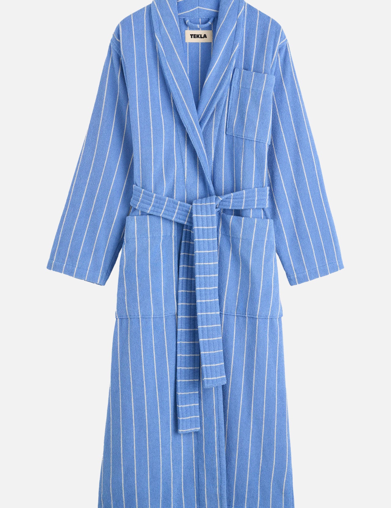 TEKLA Terry Classic Unisex Bathrobe in blue organic cotton with white vertical stripes, a waist tie, and a chest pocket.