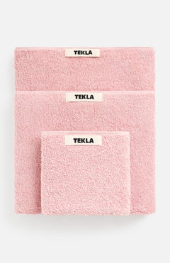 Three soft Terry Towel Washcloth sets in descending sizes, each featuring a centered TEKLA brand label and a matching pink washcloth.