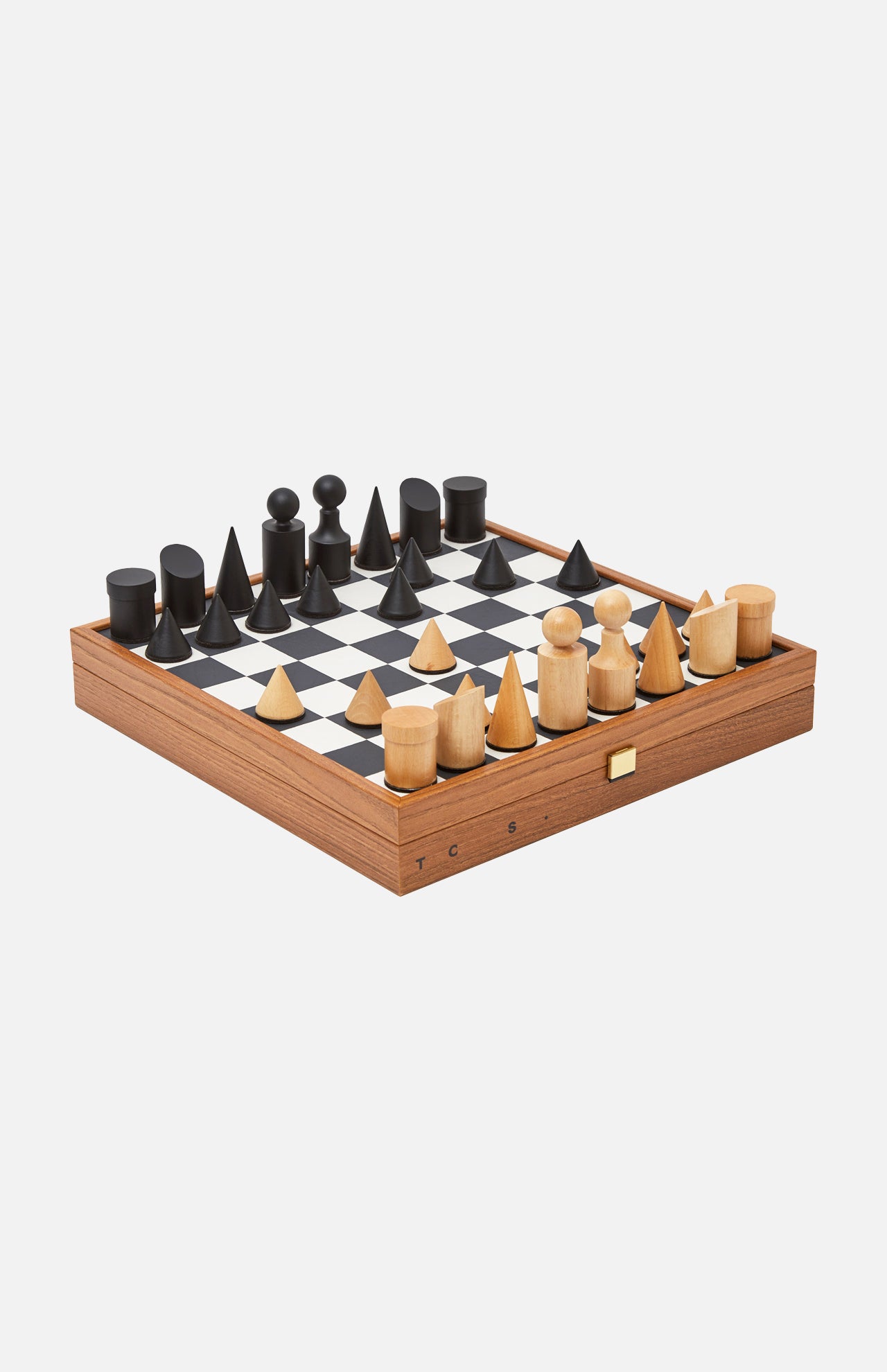 The Milos Black And White Chess Game Set by THE CONRAN SHOP features geometric black and light tulip wood pieces on a bold black and white checkered board with a wooden frame, perfect for modern minimalist decor.