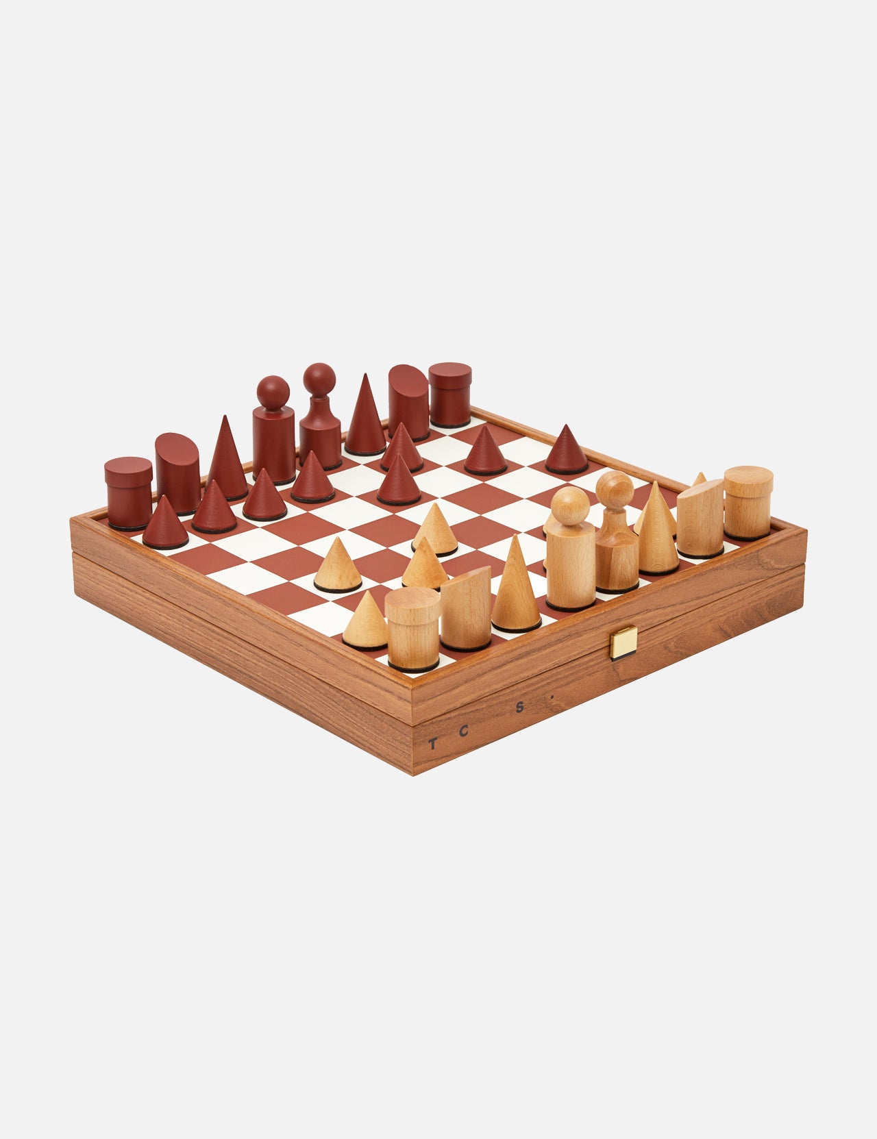 The Milos Terracotta Chess Game Set by THE CONRAN SHOP is a handcrafted set with minimalist, geometric wood pieces in natural and reddish-brown on a square board with a side drawer.