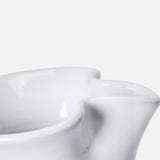 Close-up of THE CONRAN SHOP Puglia Jug with Ring Handle, a white ceramic piece featuring a glossy finish and prominent spout, inspired by traditional Puglia craftsmanship, set against a plain white background.