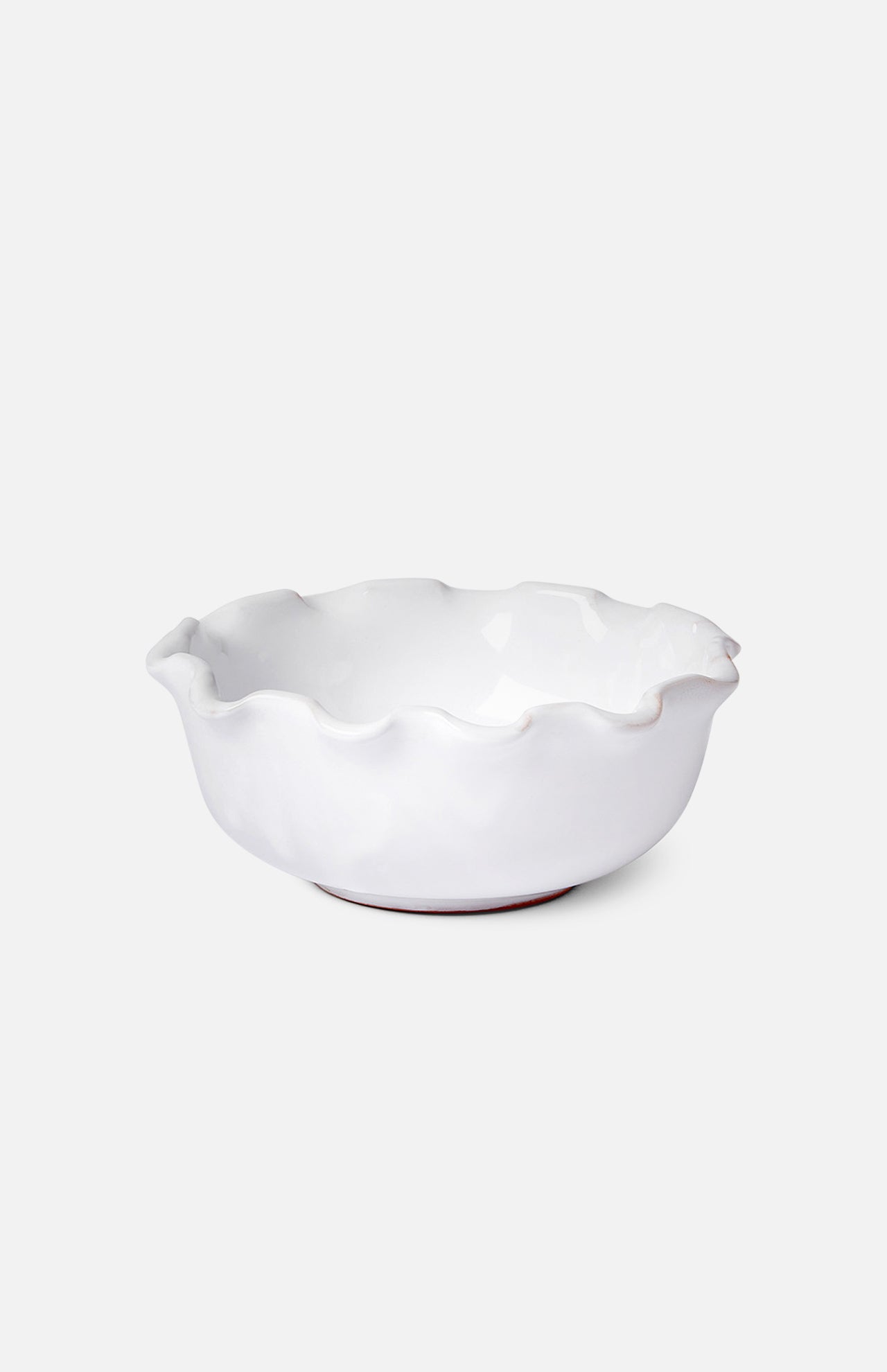 The Puglia Scalloped Small Bowl by THE CONRAN SHOP, crafted in white stoneware with scalloped edges and a glossy finish, sits on a plain white background, highlighting the timeless elegance of handcrafted Italian design.