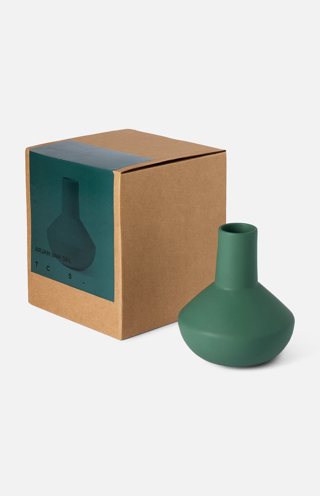 The Sphere Bottle Vase by THE CONRAN SHOP, a matte forest green modern earthenware piece with a wide base and narrow neck, is shown next to its brown cardboard packaging featuring an image and label of the vase.