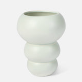 The Conran Shop's Stacked Spheres Vase Mint features a modern, matte finish with three rounded, stacked sections and a wide opening, inspired by Arjan Van Dal’s elegant forms.