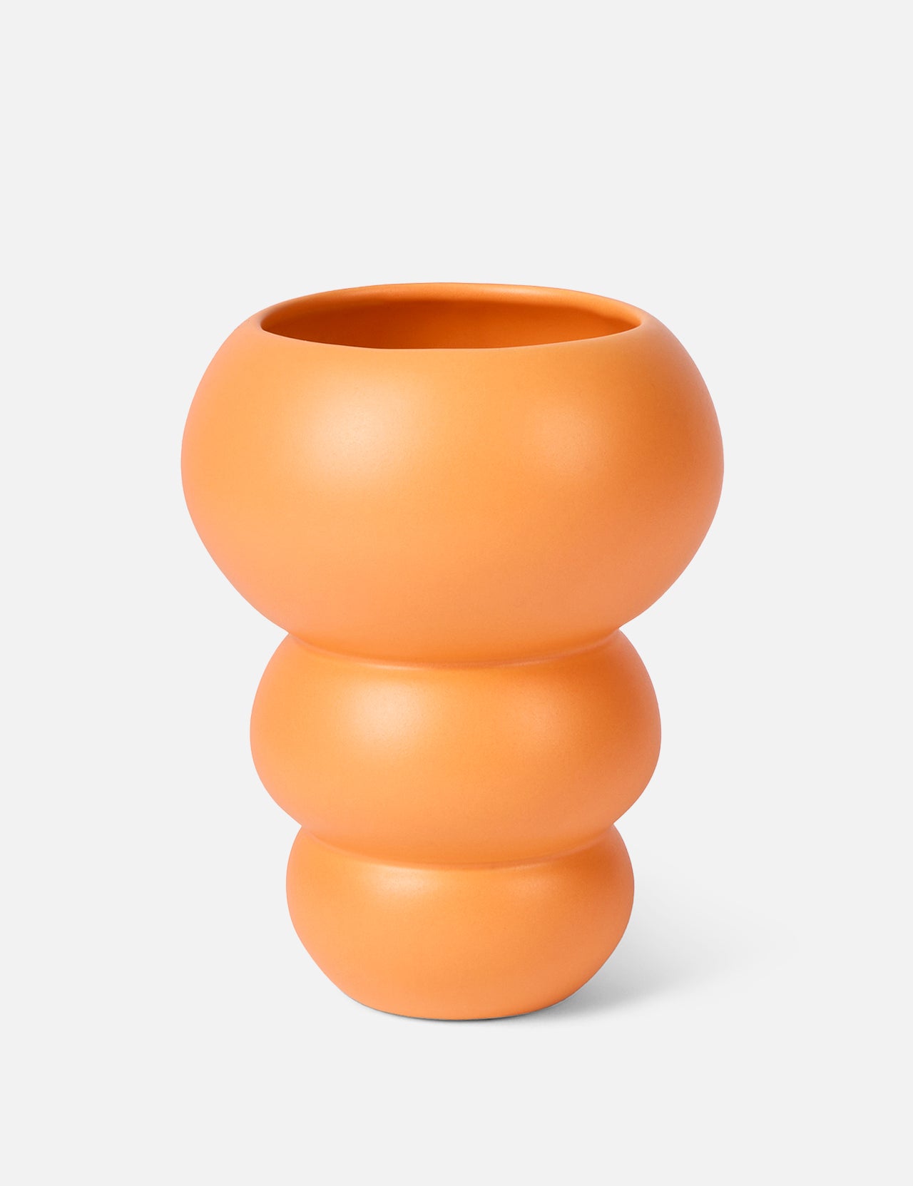 The Stacked Spheres Vase Orange by THE CONRAN SHOP features a matte, three-tiered earthenware design in tangerine, shown against a plain light background.