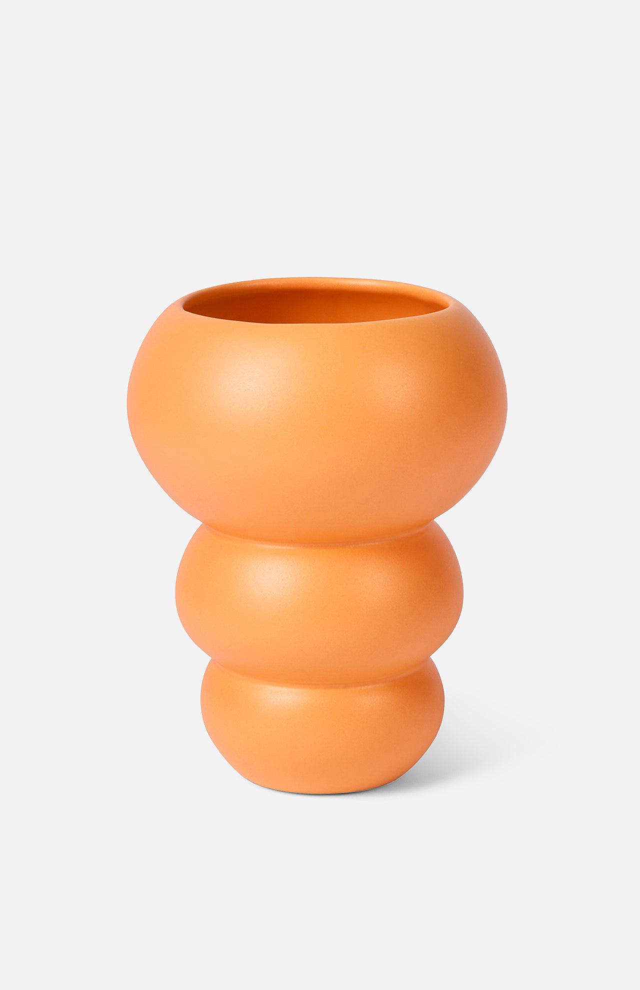 The Stacked Spheres Vase Orange by THE CONRAN SHOP features a matte, three-tiered earthenware design in tangerine, shown against a plain light background.