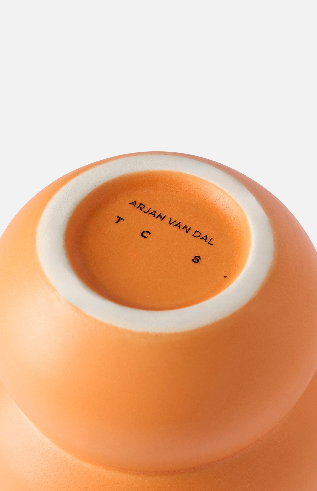 The Stacked Spheres Vase Orange by THE CONRAN SHOP is shown from the bottom, revealing a white rim and "THE CONRAN SHOP" printed in black on its base.