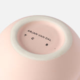 The base of the Stacked Spheres Vase Plaster from THE CONRAN SHOP has "THE CONRAN SHOP" printed in black capital letters on its unglazed bottom ring.