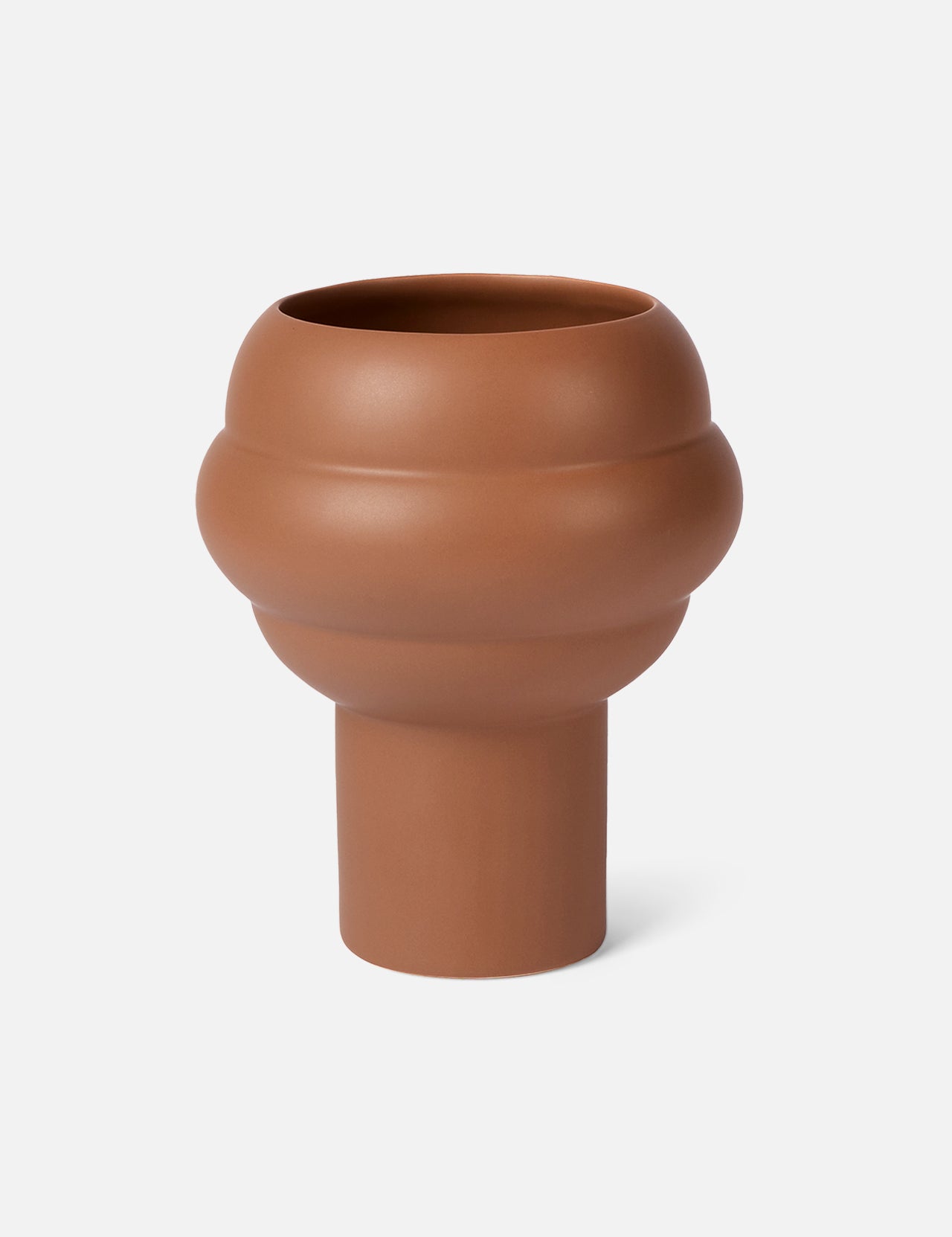 The Tree Vase Cocao by THE CONRAN SHOP is a modern earthenware piece with a matte finish, featuring a wide rounded top and narrow cylindrical base in rich brown, shown against a plain white background.