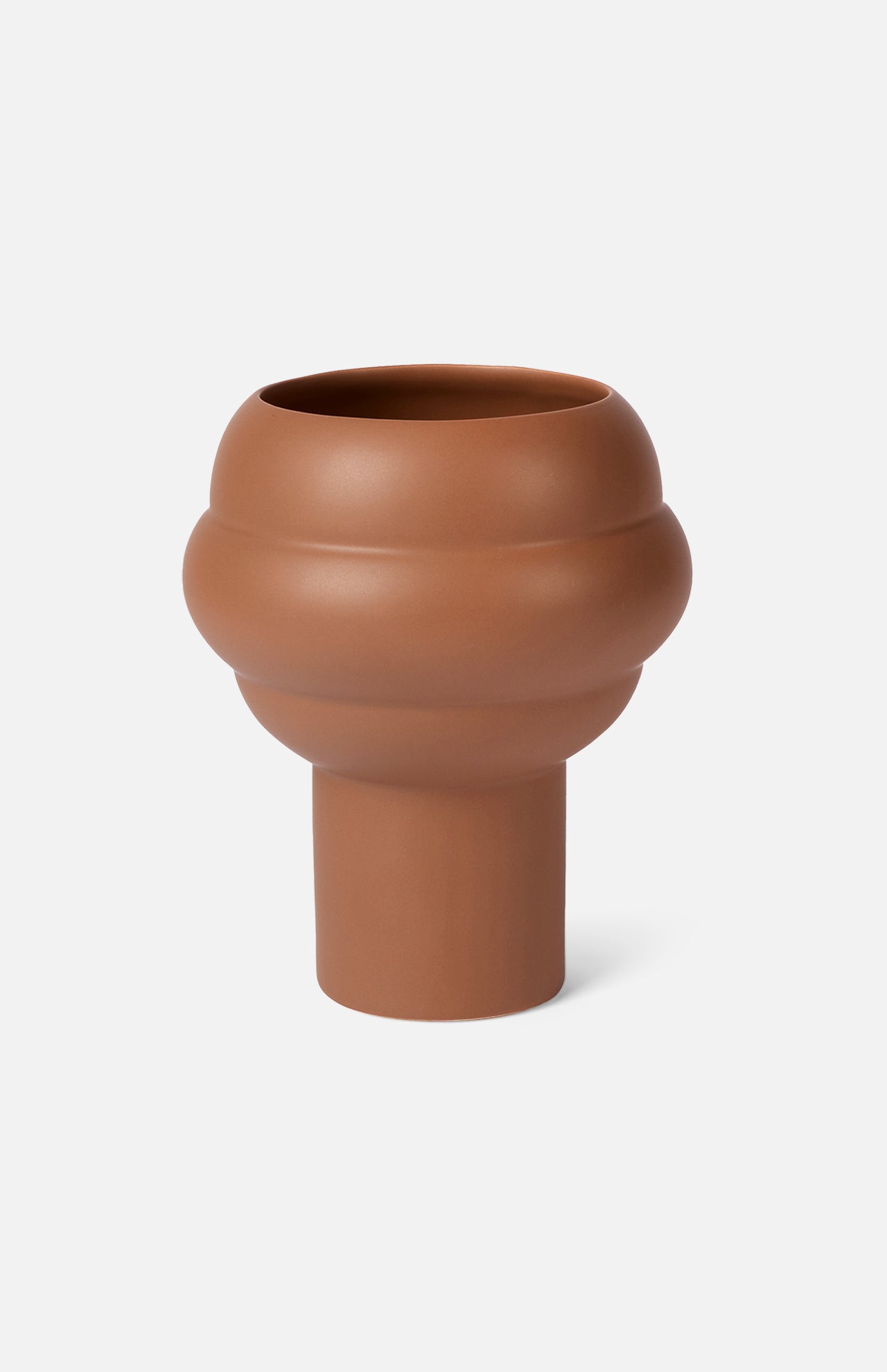 The Tree Vase Cocao by THE CONRAN SHOP is a modern earthenware piece with a matte finish, featuring a wide rounded top and narrow cylindrical base in rich brown, shown against a plain white background.