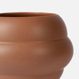 A close-up of THE CONRAN SHOP's Tree Vase Cocao, a modern brown earthenware vase with a smooth, rounded curvy silhouette, set against a plain white background.