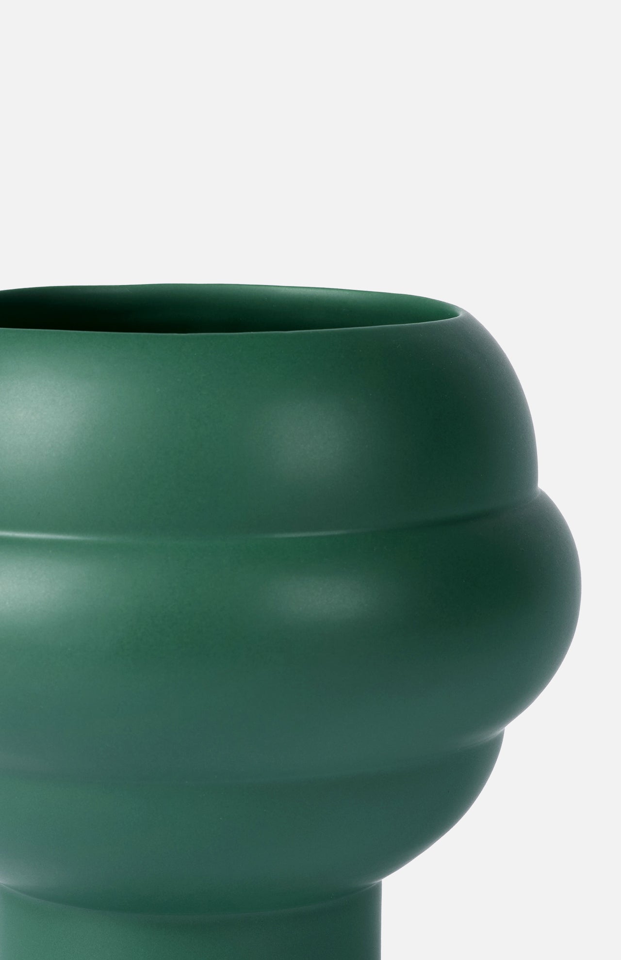 A close-up of THE CONRAN SHOP's Tree Vase Forest Green, featuring a rounded, bulbous matte silhouette and smooth finish, set against a plain white background.