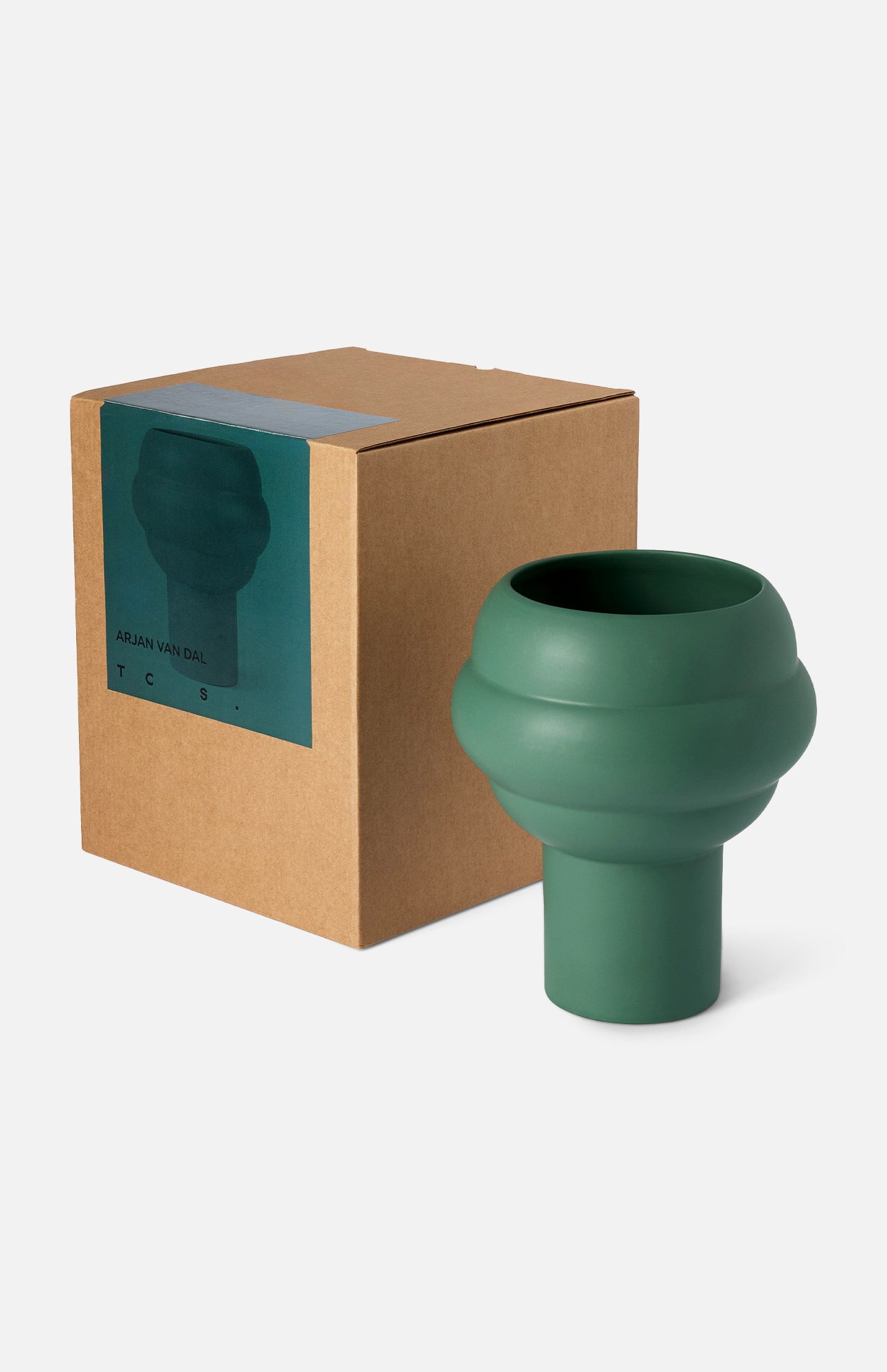 The Tree Vase Forest Green by THE CONRAN SHOP, a matte earthenware piece with rounded tiers, stands beside its box featuring an image and labeling. Inspired by Arjan Van Dal’s timeless design.