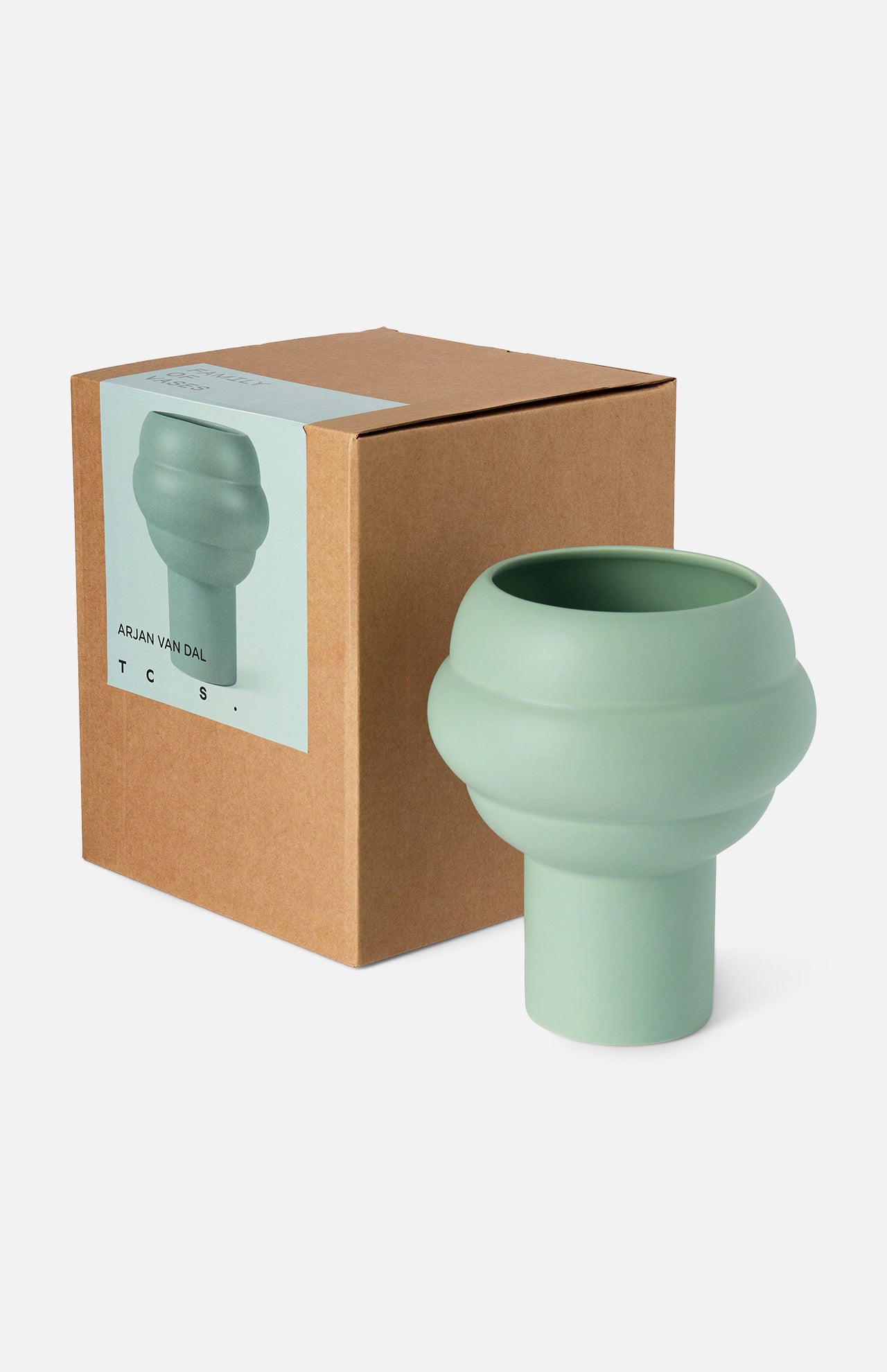 The CONRAN SHOP's Tree Vase Sage Green features a modern matte finish and layered rounded design, shown beside its brown cardboard box displaying an image and label of the earthenware vase on the front.