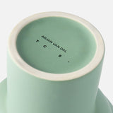 The base of a Tree Vase Sage Green by THE CONRAN SHOP is shown, featuring its name and branding printed in black text.