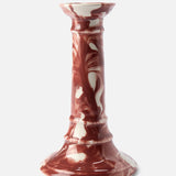 The Marbled Wardour Candlestick by THE CONRAN SHOP is an earthenware piece made in England, featuring a hand-marbled reddish-brown and white glaze, flared base, and glossy finish.