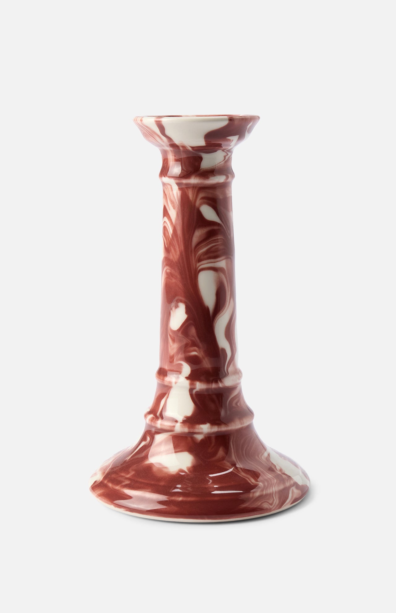 The Marbled Wardour Candlestick by THE CONRAN SHOP is an earthenware piece made in England, featuring a hand-marbled reddish-brown and white glaze, flared base, and glossy finish.