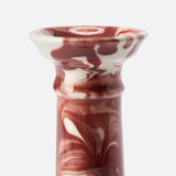 The Marbled Wardour Candlestick by THE CONRAN SHOP features a wide, flared rim and a hand-marbled red and white glaze set against a plain white background.