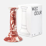 The Marbled Wardour Candlestick by THE CONRAN SHOP, featuring a hand-marbled red and white glaze, is displayed beside a white box with a line drawing of the holder and bold, modern "wardour" text.