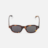 CELINE Round Brown Tortoiseshell Sunglasses with dark lenses, inspired by luxury French fashion, are displayed on a plain white background.