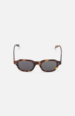 CELINE Round Brown Tortoiseshell Sunglasses with dark lenses, inspired by luxury French fashion, are displayed on a plain white background.