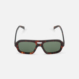 CELINE Aviator Brown Tortoiseshell Sunglasses feature a rectangular shape, green lenses, and a dark patterned frame inspired by luxury French style, shown against a plain white background.