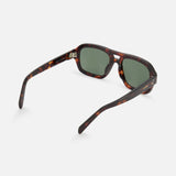 The CELINE Aviator Brown Tortoiseshell Sunglasses feature green lenses and slightly curved arms, displayed from a rear/side angle on a white background. The visible inside hinge reflects classic French luxury style.