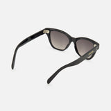 CELINE Cat Eye Black Sunglasses, featuring luxurious acetate frames with gradient dark lenses, are displayed from a rear angle against a plain white background. The open arms highlight the CELINE logo in gold on the left temple—an elegant accessory crafted in Italy.