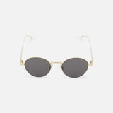 The CELINE Celine Round Gold Sunglasses feature oval-shaped dark lenses and thin gold metal frames, reflecting the timeless elegance of the French fashion house. Shown on a white background.