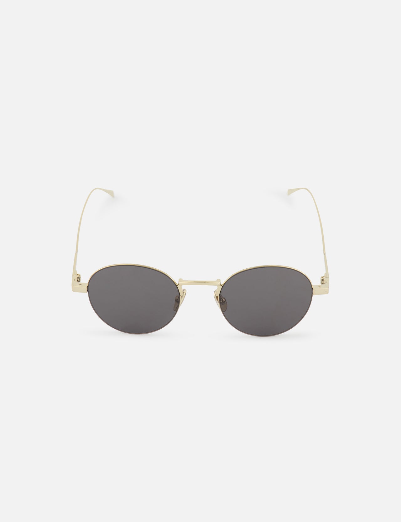 The CELINE Celine Round Gold Sunglasses feature oval-shaped dark lenses and thin gold metal frames, reflecting the timeless elegance of the French fashion house. Shown on a white background.