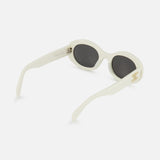 CELINE White Oval Sunglasses feature a chic oval shape, dark lenses, and a gold emblem on the side, showcasing the brand's timeless French elegance. Displayed against a plain white background.
