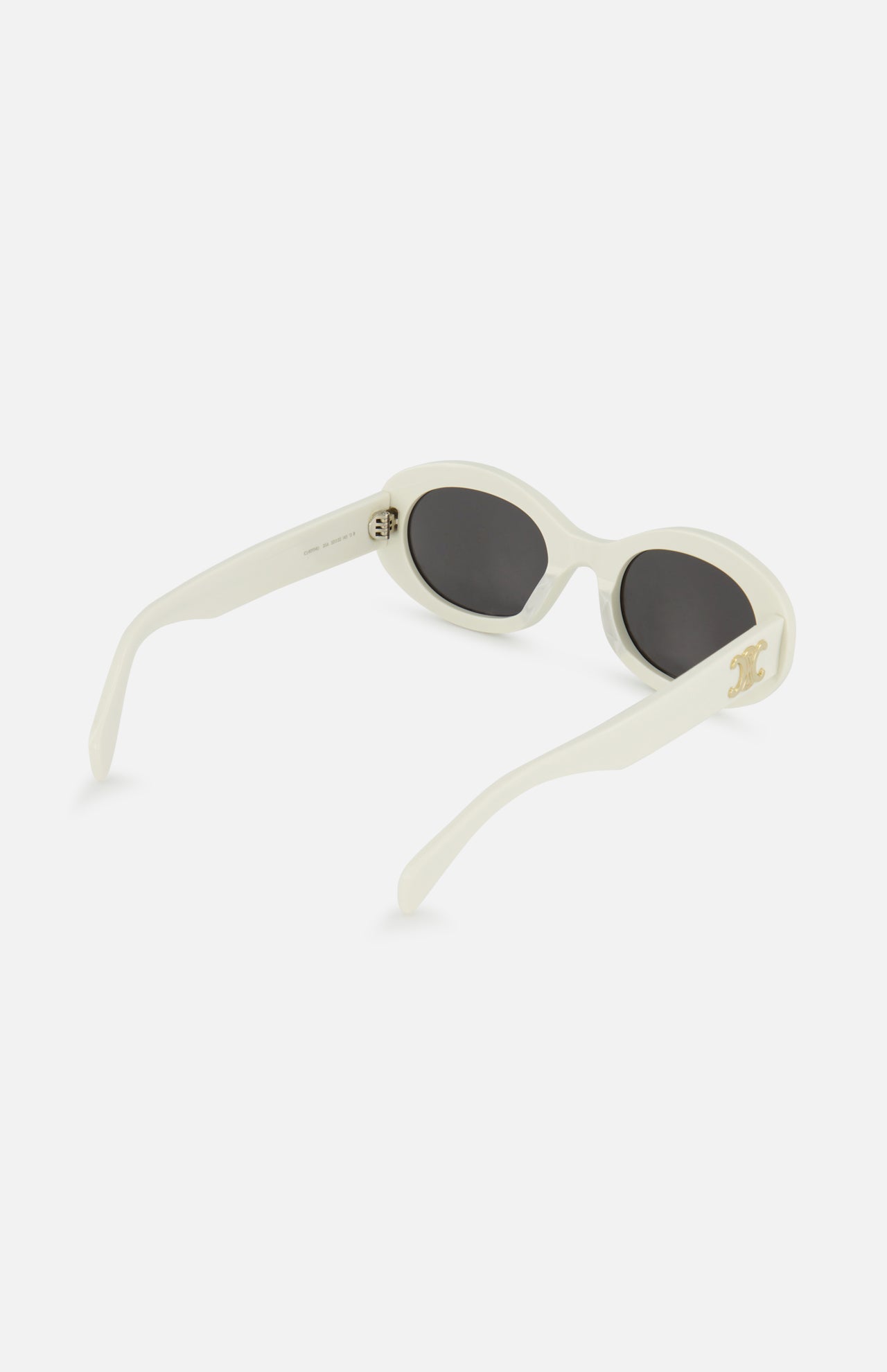 CELINE White Oval Sunglasses feature a chic oval shape, dark lenses, and a gold emblem on the side, showcasing the brand's timeless French elegance. Displayed against a plain white background.
