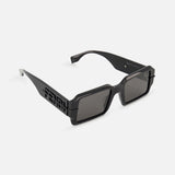Fendi Rectangular Black Sunglasses by FENDI feature thick-edged black frames, dark lenses, and bold Fendi lettering cut out on the temples. Displayed against a plain white background.