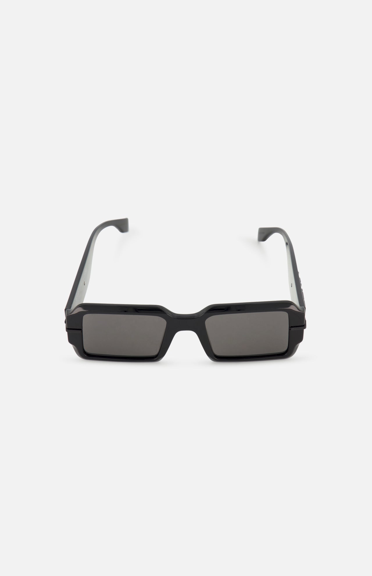 The FENDI Rectangular Black Sunglasses feature thick frames and dark grey lenses, offering a bold statement style.