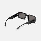 The FENDI Rectangular Black Sunglasses feature thick arms, tinted lenses, and a cut-out Fendi logo on the temples. These statement sunglasses are displayed on a plain white background.