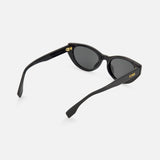 The Fendi Cat Eye Black Sunglasses by FENDI feature dark lenses, a gold logo on the temple, and curved arms—stylish black designer eyewear shown against a white background.