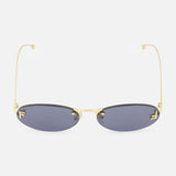 Fendi Oval Gold Sunglasses by FENDI, featuring dark lenses and thin gold frames with subtle gold Fendi lettering on the arms, shown from the front against a white background.