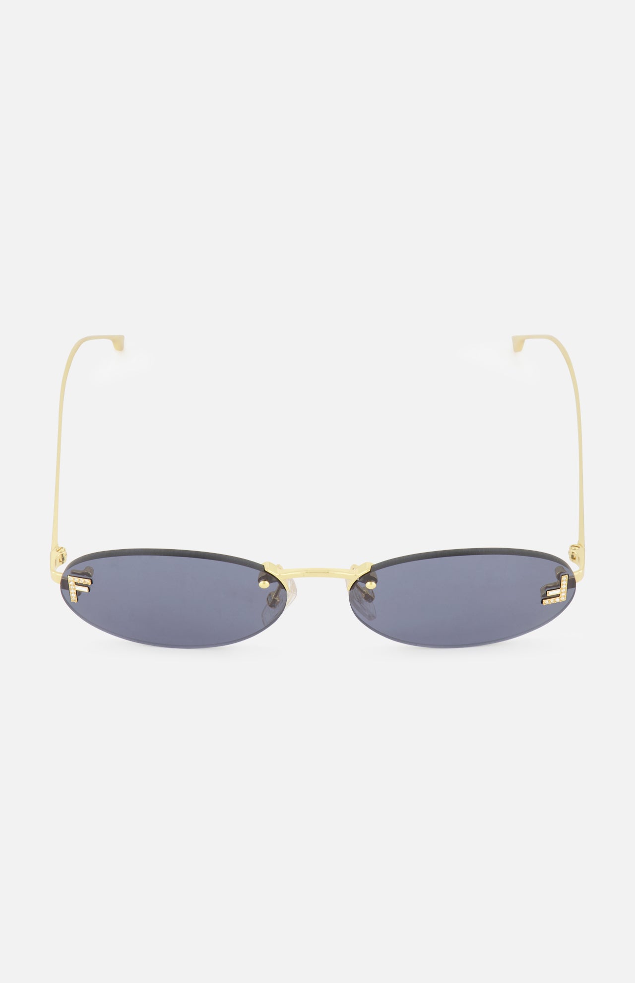 Fendi Oval Gold Sunglasses by FENDI, featuring dark lenses and thin gold frames with subtle gold Fendi lettering on the arms, shown from the front against a white background.