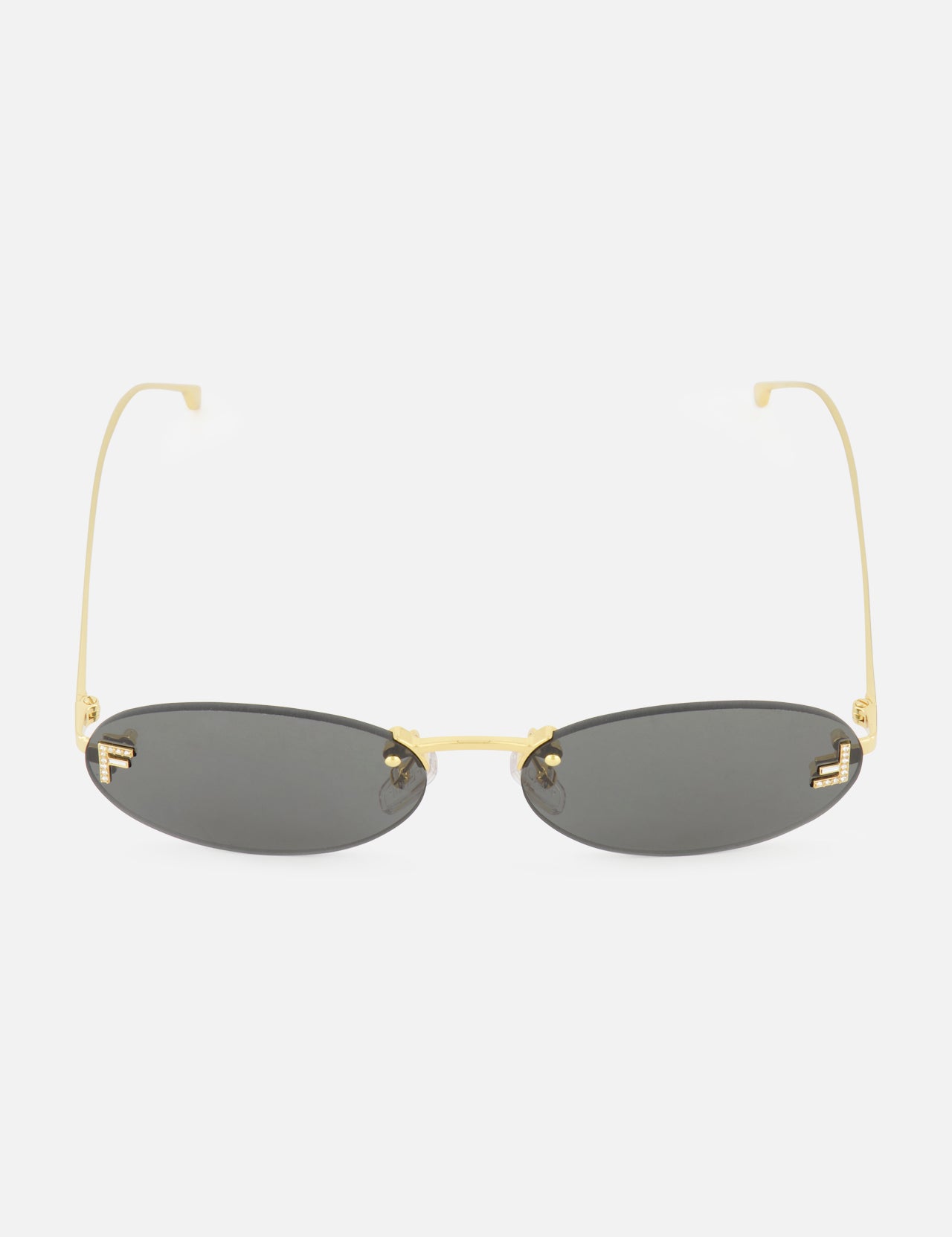 The FENDI Oval Gold Sunglasses feature a sleek gold metal frame and dark tinted lenses, presented against a plain white background.