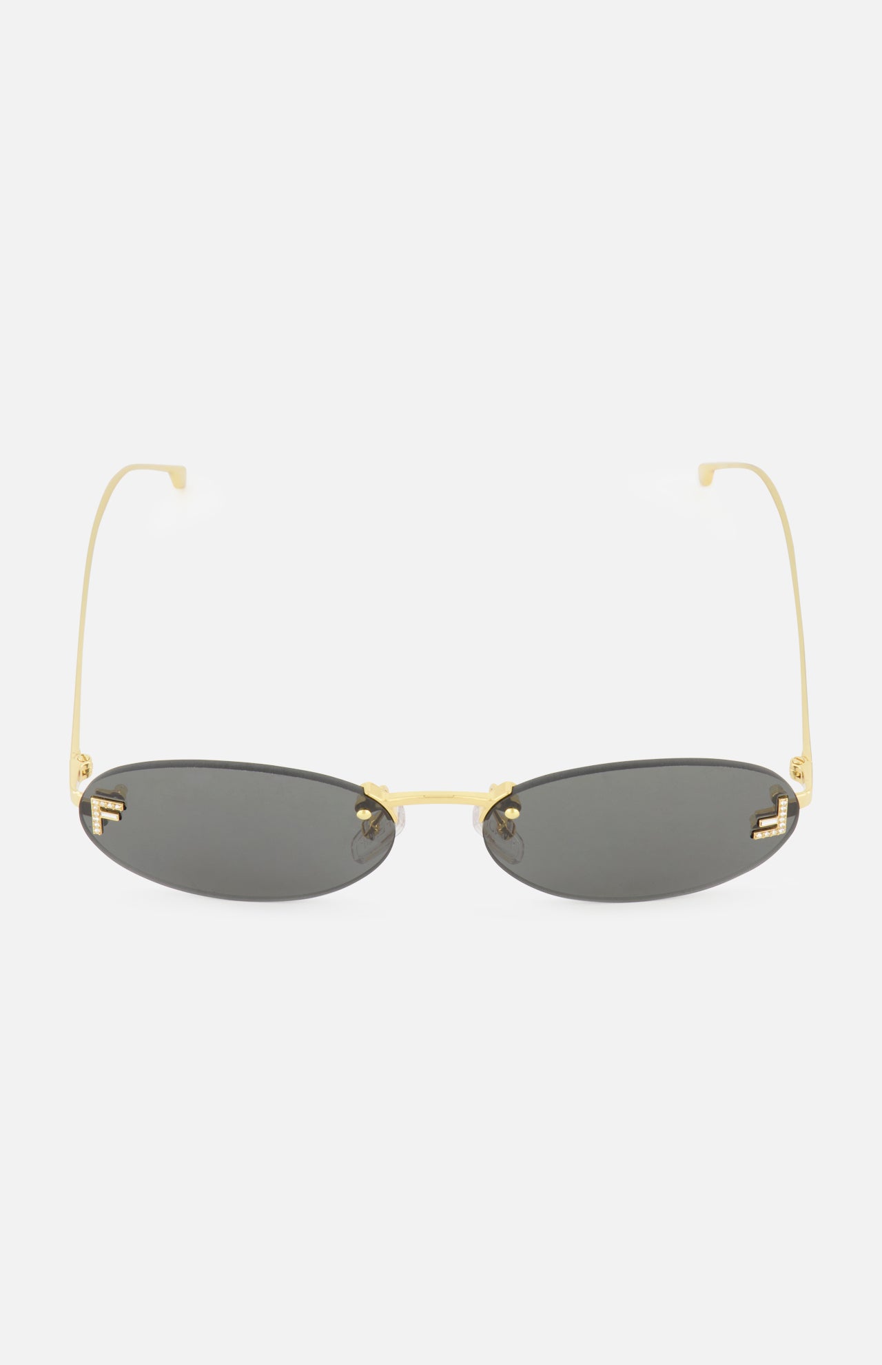 The FENDI Oval Gold Sunglasses feature a sleek gold metal frame and dark tinted lenses, presented against a plain white background.