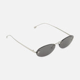 Introducing the Fendi Oval Silver Sunglasses by FENDI, featuring an oval-shaped, rimless design with thin silver metal frames and dark lenses. Displayed on a white background, these sunglasses showcase minimalist elegance with curved arms, making them a sophisticated accessory for any occasion.