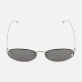 Fendi Oval Silver Sunglasses by FENDI featuring thin silver metal arms and black tinted lenses, showcased on a white background.