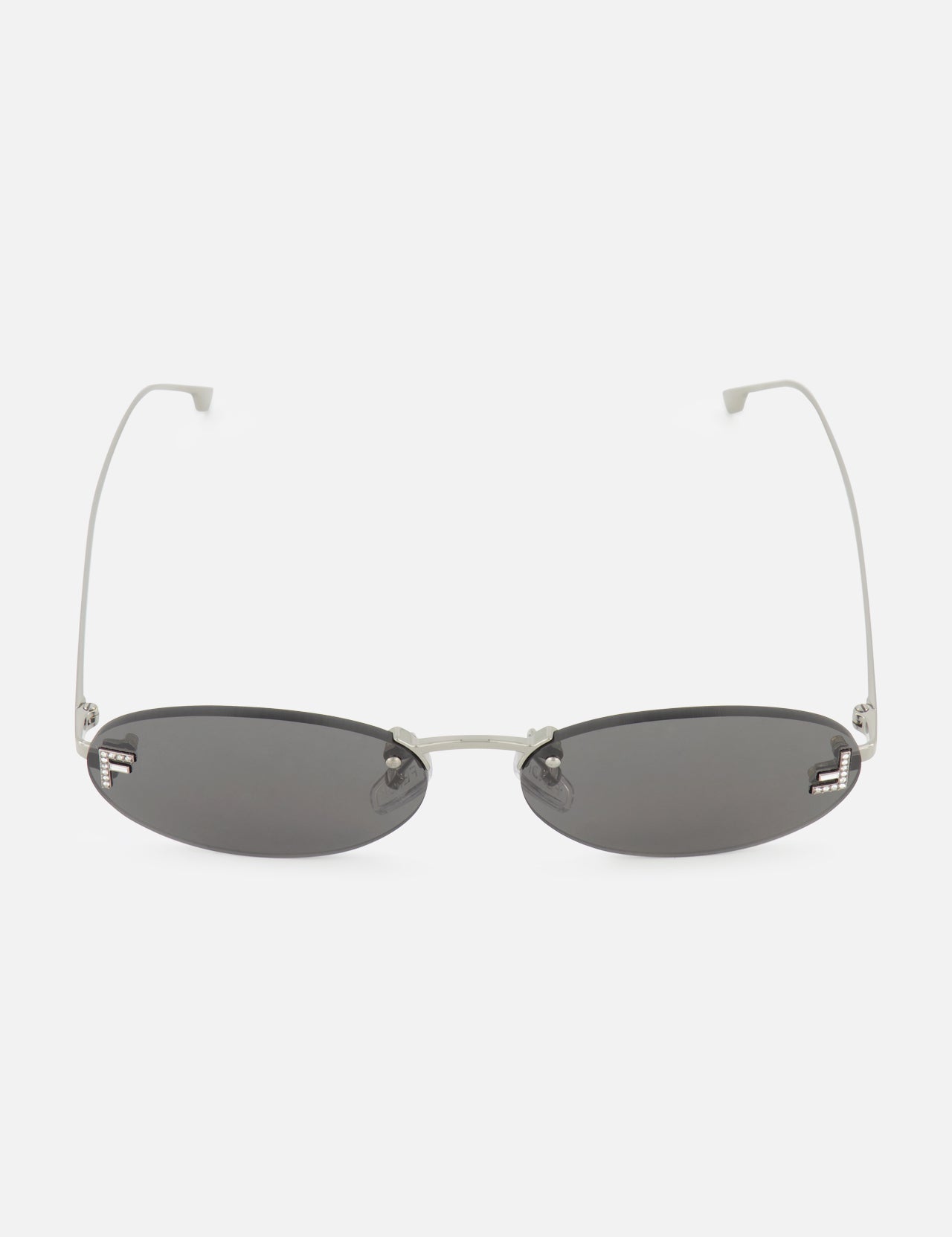 Fendi Oval Silver Sunglasses by FENDI featuring thin silver metal arms and black tinted lenses, showcased on a white background.
