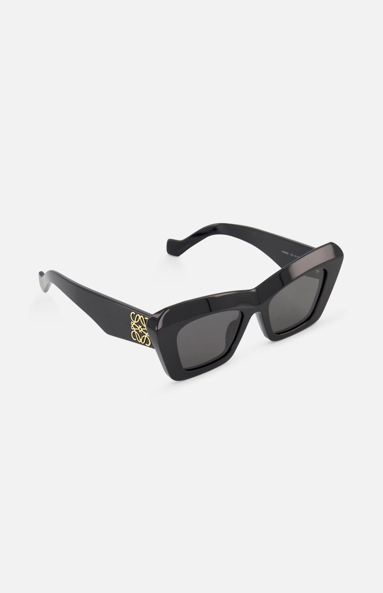 LOEWE Cat Eye Black Sunglasses feature thick acetate frames, dark lenses, and a gold logo on the temples, shown on a white background for a signature designer look.