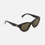 The Loewe Cat Eye Black Sunglasses by LOEWE feature glossy acetate frames with a tortoiseshell rim, brown lenses, and a gold logo detail on the temple for an elegant finish.