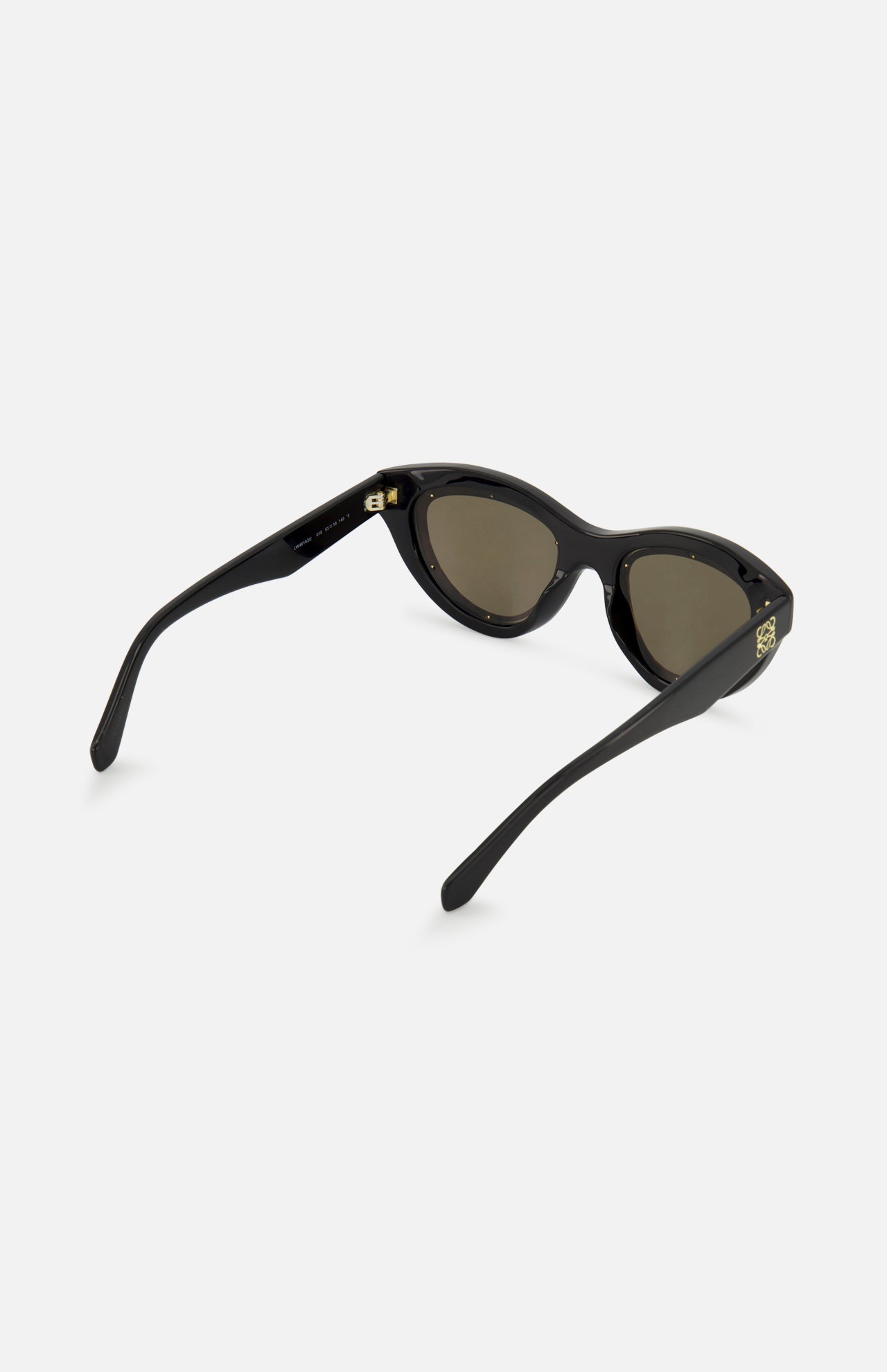 LOEWE Cat Eye Black Sunglasses, crafted in Italy from premium acetate with dark lenses, thick arms, and gold accents at the hinges, are shown against a light gray background.