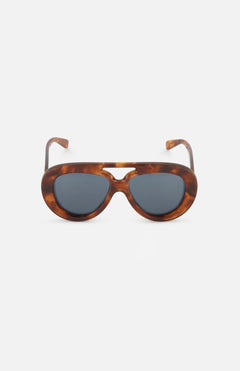 The LOEWE Aviator Brown Tortoiseshell Sunglasses are displayed against a plain white background. These sunglasses by LOEWE feature thick, oval frames in a brown tortoiseshell pattern with dark lenses and a keyhole bridge, combining timeless style with modern design elements.