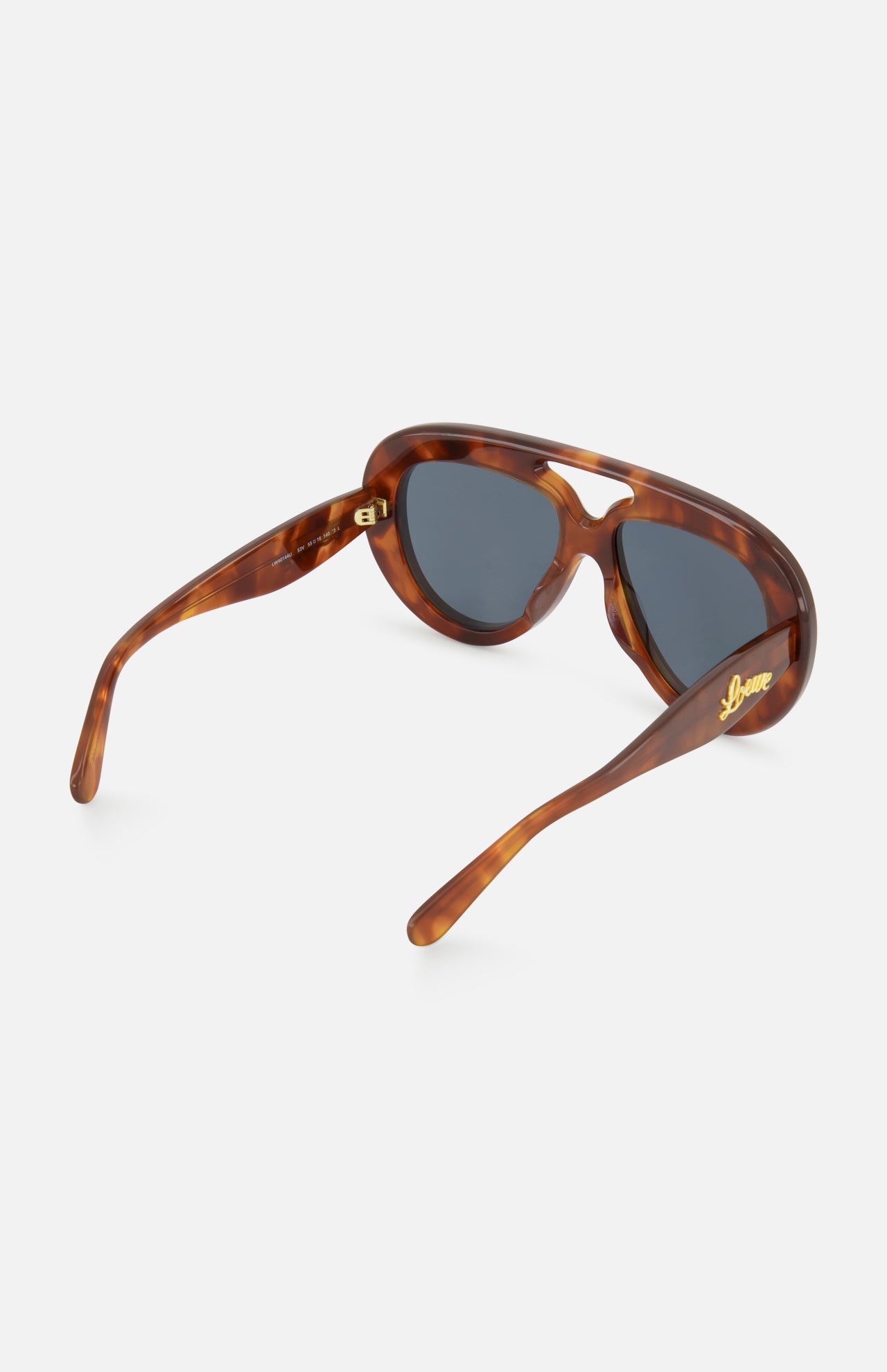The Loewe Aviator Brown Tortoiseshell Sunglasses by LOEWE feature thick frames and dark lenses, shown at an angle to highlight the gold LOEWE branding on the left arm—these statement aviators put a bold spin on the classic silhouette.