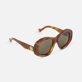 LOEWE Oval Brown Tortoiseshell Sunglasses feature oval lenses and gold accents on the temples, shown against a plain white background.