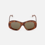 The LOEWE Oval Brown Tortoiseshell Sunglasses feature dark lenses and gently curved arms, combining luxury and timeless sophistication. Displayed on a plain white background, these sunglasses embody LOEWE’s iconic style.